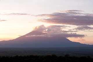Mount Kilimanjaro /ˌkɪlɪmənˈdʒɑːroʊ/,[6] with its three volcanic cones, "Kibo", "Mawenzi", and "Shira", is a dormant volcano in Tanzania.